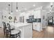 Bright kitchen features white cabinetry, stainless steel appliances, and herringbone backsplash at 1914 Carovel Way, Kennesaw, GA 30144