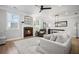 Cozy living room with fireplace, hardwood floors and abundant natural light at 1914 Carovel Way, Kennesaw, GA 30144