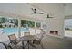 Covered poolside lounge with outdoor fireplace, ceiling fans, and view of community pool at 1914 Carovel Way, Kennesaw, GA 30144