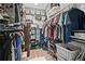 Large walk-in closet with custom shelving and ample storage space for clothes and accessories at 1914 Carovel Way, Kennesaw, GA 30144