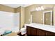 Full bathroom with a combined bathtub and shower and vanity with dark cabinets at 3461 Dianthus Ln, Lawrenceville, GA 30044
