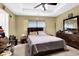 Cozy bedroom with a ceiling fan, and dresser, creating a relaxing retreat at 3461 Dianthus Ln, Lawrenceville, GA 30044