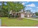 Exterior view of a two-story townhome with brick accents and a well-manicured lawn at 3461 Dianthus Ln, Lawrenceville, GA 30044