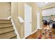 Hallway with wooden floors, stairs, and neutral paint at 3461 Dianthus Ln, Lawrenceville, GA 30044