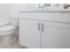 Well-lit bathroom vanity with white cabinets, and grey tiled floor at 354 Olmstead Way # 27, Alpharetta, GA 30022
