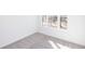Bedroom featuring neutral carpeting, large windows, and bright natural light at 354 Olmstead Way # 27, Alpharetta, GA 30022