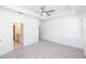 Large bedroom with plush carpeting, ensuite bathroom, and tray ceiling with fan at 354 Olmstead Way # 27, Alpharetta, GA 30022
