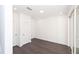 Bright bedroom with dark hardwood floors, and sliding glass doors at 354 Olmstead Way # 27, Alpharetta, GA 30022