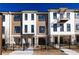 New townhouse showcasing modern design, brick accents, and wrought iron fencing at 354 Olmstead Way # 27, Alpharetta, GA 30022
