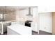 Modern kitchen featuring white cabinets, stainless steel appliances, and a center island at 354 Olmstead Way # 27, Alpharetta, GA 30022