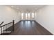Upstairs living room featuring hardwood floors and access to an outdoor balcony at 354 Olmstead Way # 27, Alpharetta, GA 30022