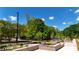 A serene community park with walking paths and lush landscaping under a blue sky at 354 Olmstead Way # 27, Alpharetta, GA 30022