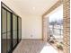 Outdoor patio featuring brick flooring, brick column, and sliding glass doors at 354 Olmstead Way # 27, Alpharetta, GA 30022