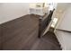 Stairway leading to an open kitchen and living area with hardwood flooring at 354 Olmstead Way # 27, Alpharetta, GA 30022