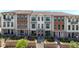 Charming three-story townhomes featuring brick accents and well-manicured lawns at 354 Olmstead Way # 27, Alpharetta, GA 30022