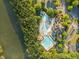 A full aerial shot of the pool, surrounded by lush trees, with a parking lot on the side at 406 Genevieve Dr, Canton, GA 30114