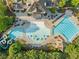 Aerial view showcasing the community pool and amenities, with lush landscaping and ample seating at 406 Genevieve Dr, Canton, GA 30114