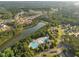Beautiful aerial view of the community, showcasing lush greenery, a lake, and the pool at 406 Genevieve Dr, Canton, GA 30114
