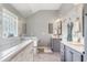 Bright bathroom with double vanity, a tub with tile surround, and large tiles at 406 Genevieve Dr, Canton, GA 30114