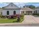 Charming single-story home with a well-manicured lawn, mature landscaping, and a two-car garage at 406 Genevieve Dr, Canton, GA 30114