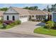 Charming single-story home with a well-manicured lawn, mature landscaping, and a two-car garage at 406 Genevieve Dr, Canton, GA 30114
