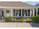 Charming covered front porch with rocking chairs, offering a perfect spot to relax and enjoy the neighborhood at 406 Genevieve Dr, Canton, GA 30114