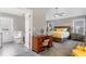 Bright Main bedroom with a bathroom, modern furnishings, ceiling fan, and lots of natural light at 406 Genevieve Dr, Canton, GA 30114
