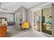 Relaxing main bedroom features a ceiling fan, neutral walls, and a sliding glass door to the outdoor patio area at 406 Genevieve Dr, Canton, GA 30114