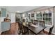 Open dining space with views of the kitchen, hardwood floors, and natural light at 1050 Birdseye Vw, Locust Grove, GA 30248
