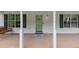 Charming covered front porch with swing, front door, and a welcome mat at 1050 Birdseye Vw, Locust Grove, GA 30248