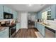 Bright kitchen showcases stainless steel appliances, granite countertops, and hardwood floors at 1050 Birdseye Vw, Locust Grove, GA 30248