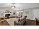 Bright living room featuring a fireplace, comfortable seating, and stylish decor at 1050 Birdseye Vw, Locust Grove, GA 30248