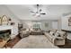 Inviting living room showcasing hardwood floors, neutral walls, and a cozy fireplace at 1050 Birdseye Vw, Locust Grove, GA 30248