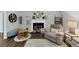 Cozy living room featuring a fireplace, hardwood floors, and comfortable armchair at 1050 Birdseye Vw, Locust Grove, GA 30248