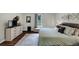 Spacious main bedroom featuring a dresser with television, decor, and a comfortable bed and carpeted floors at 1050 Birdseye Vw, Locust Grove, GA 30248
