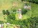 High-angle view of the residence, accessory building and garden on a vast, green, landscaped lot at 1502 Campground Rd, Mcdonough, GA 30252