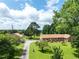 Picturesque home with large lawn and surrounded by trees at 1502 Campground Rd, Mcdonough, GA 30252