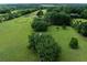 An expansive estate featuring lush, green landscapes, mature trees, and manicured lawns at 1502 Campground Rd, Mcdonough, GA 30252