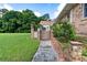 Charming backyard with well-maintained lawn, brick accents, and access to the home at 1502 Campground Rd, Mcdonough, GA 30252