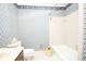 Bathroom featuring printed wallpaper, toilet and tub at 1502 Campground Rd, Mcdonough, GA 30252