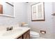 Charming powder room with floral wallpaper and vintage sink at 1502 Campground Rd, Mcdonough, GA 30252