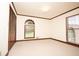 Bedroom featuring a window, closet with wood-colored trim and neutral carpet at 1502 Campground Rd, Mcdonough, GA 30252