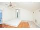 Bedroom featuring a ceiling fan, window, hardwood and tile floors at 1502 Campground Rd, Mcdonough, GA 30252
