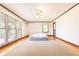 Bright bedroom features hardwood floors, ceiling fan and large window at 1502 Campground Rd, Mcdonough, GA 30252