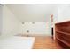 Bedroom featuring a hardwood and tile floors, white walls and vaulted ceiling at 1502 Campground Rd, Mcdonough, GA 30252