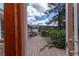 A view of a backyard deck featuring lush greenery and a detached garage at 1502 Campground Rd, Mcdonough, GA 30252