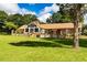 Brick home featuring many windows and a large, expansive yard at 1502 Campground Rd, Mcdonough, GA 30252