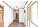 Hallway with stained glass window, chandelier and patterned tile flooring at 1502 Campground Rd, Mcdonough, GA 30252