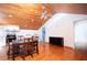 Kitchen and Dining room with wood plank ceiling and hardwood floors at 1502 Campground Rd, Mcdonough, GA 30252