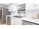 Charming kitchen with stainless steel appliances, white countertops, and a view from the window at 1502 Campground Rd, Mcdonough, GA 30252